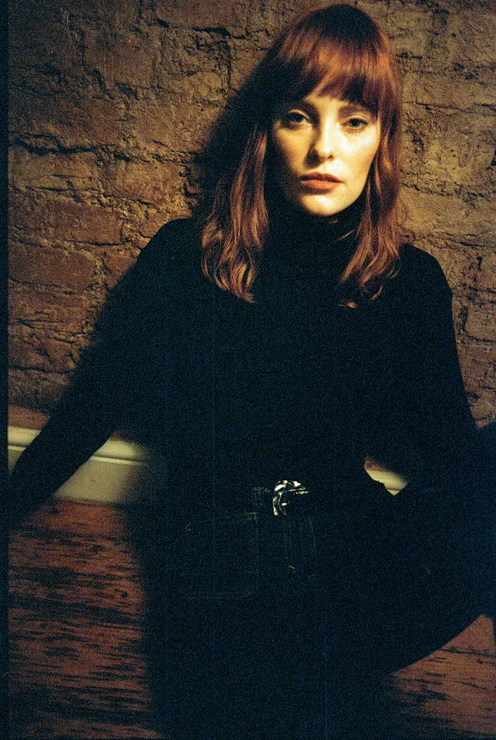 Portrait against a textured brick wall