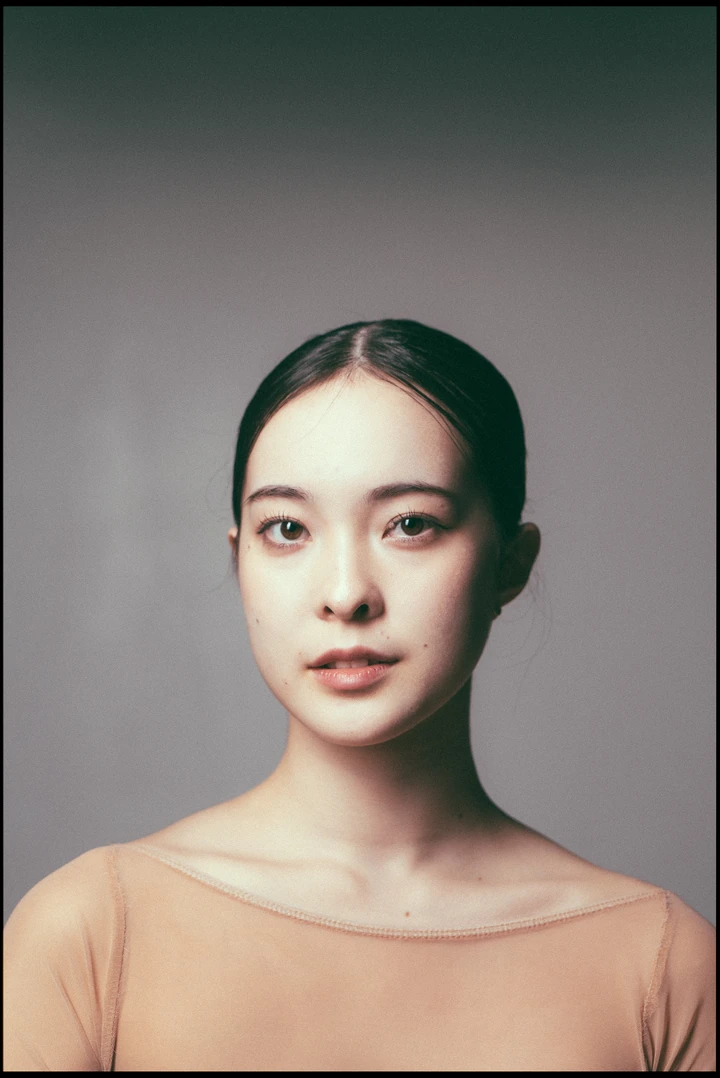 Studio headshot against a muted background