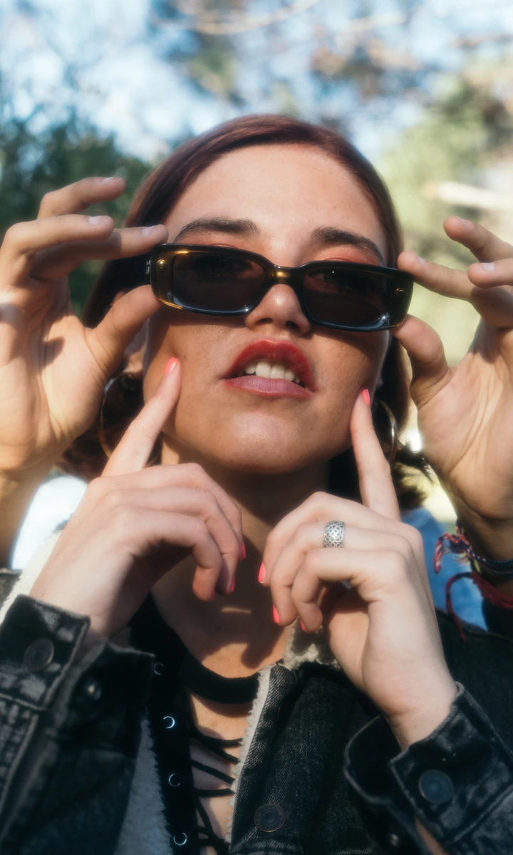 Outdoor fashion portrait with dark sunglasses