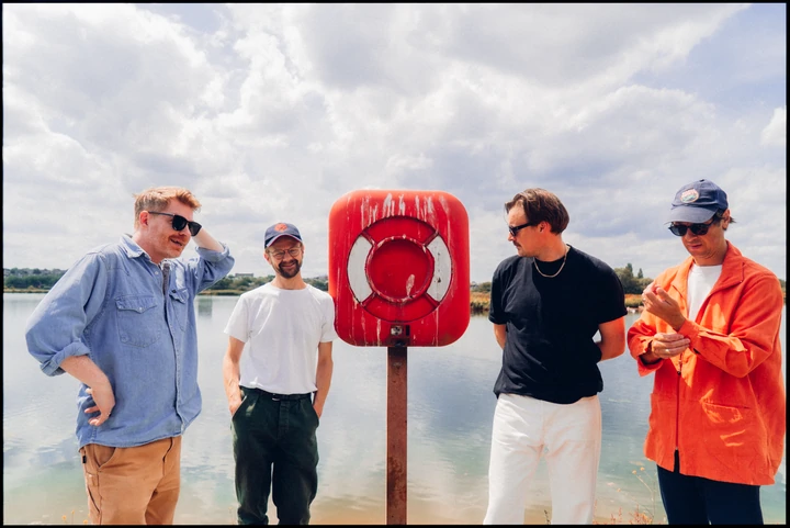 Django Django standing in an open landscape