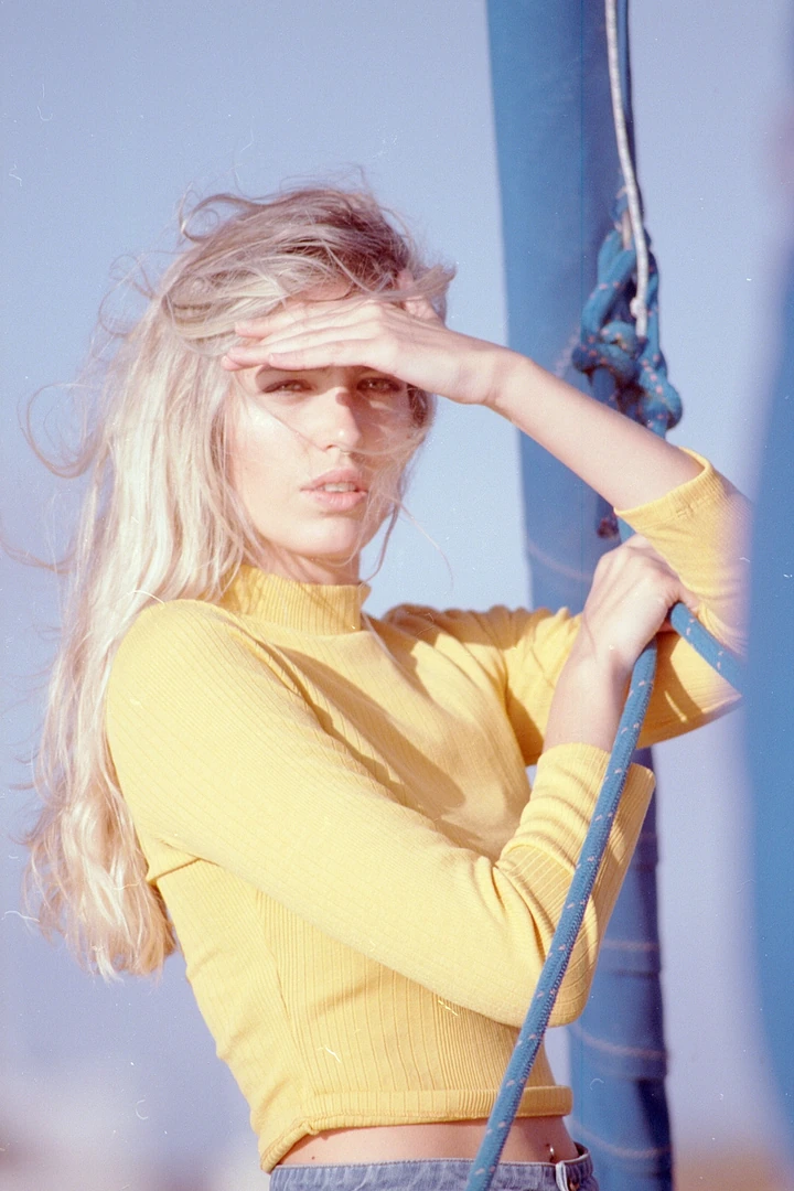 Outdoor portrait in a yellow shirt with hard sunlight