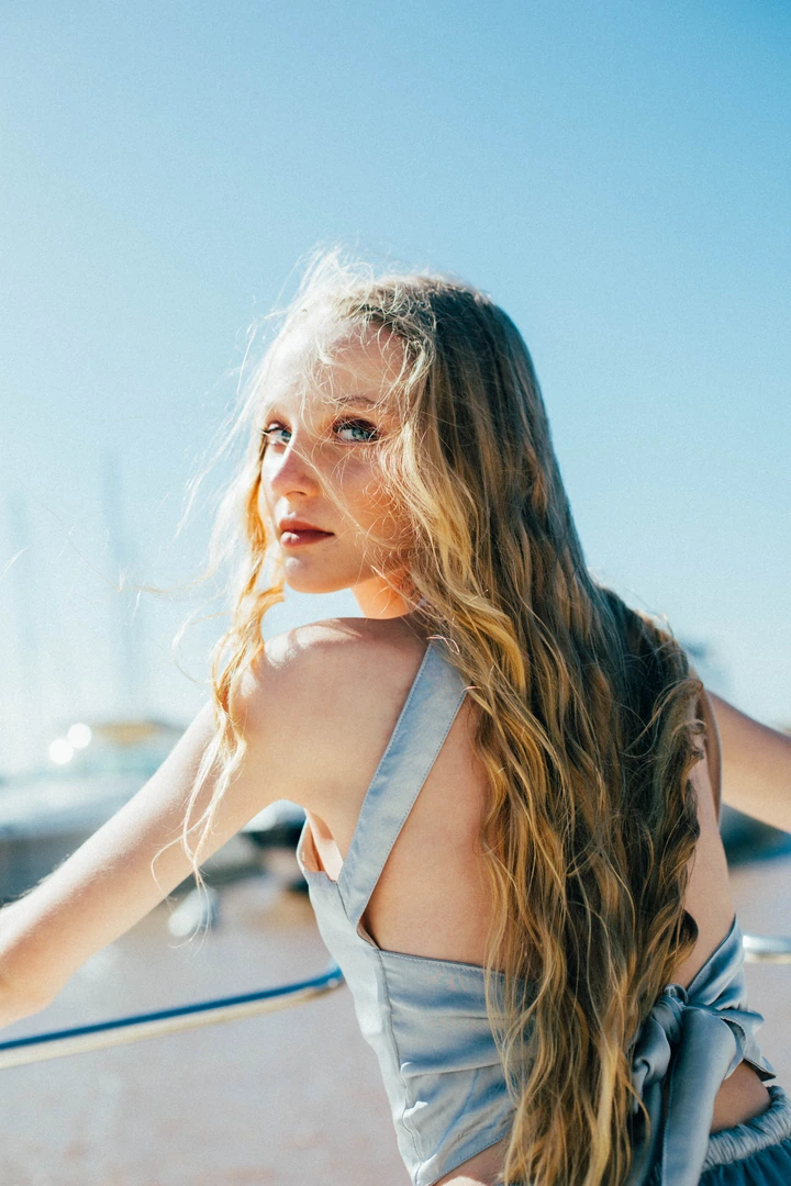 Portrait outdoors beneath a clear blue sky