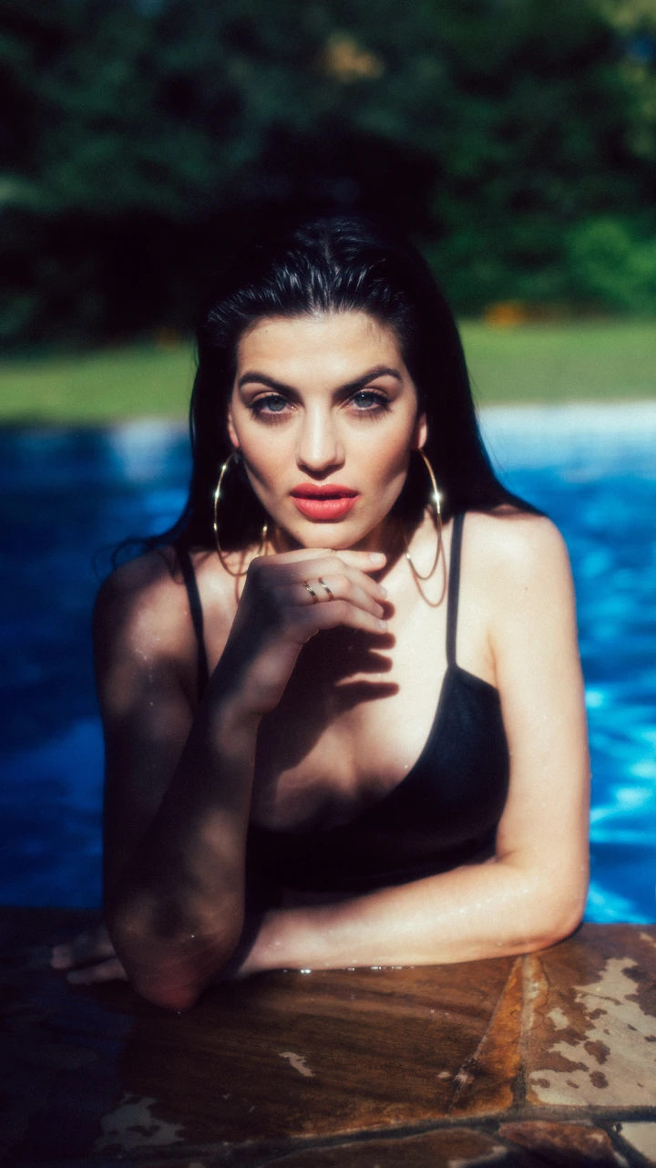 Portrait outdoors beneath deep summer shade