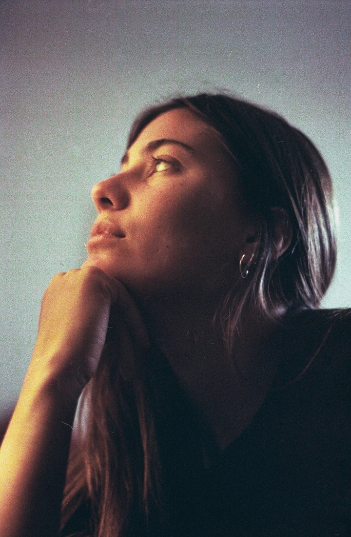 Close portrait looking upwards in soft light