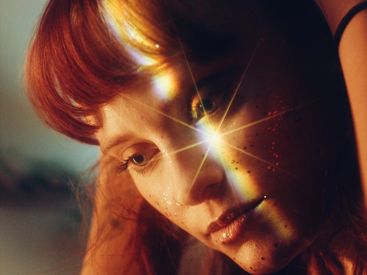 Portrait with warm light and a star-shaped flare